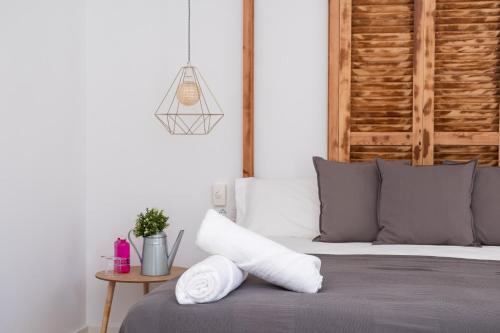 Postel nebo postele na pokoji v ubytování GOMEZ ROOMS