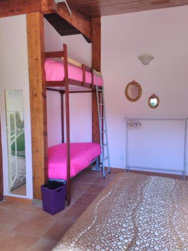 a room with two bunk beds in a room at 'O Chalet in Pozzuoli