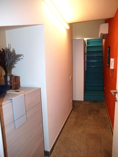 a hallway with a staircase and a room with a door at Apartments House Filipović in Makarska