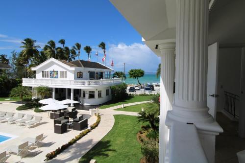 an aerial view of a house and the ocean at Albachiara Hotel - Las Terrenas in Las Terrenas