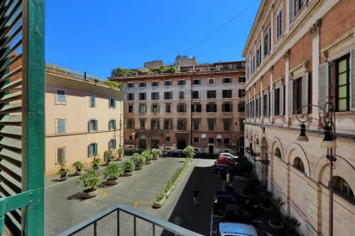 a view of a street in a city with buildings at Piazza Venezia Grand Suite in Rome