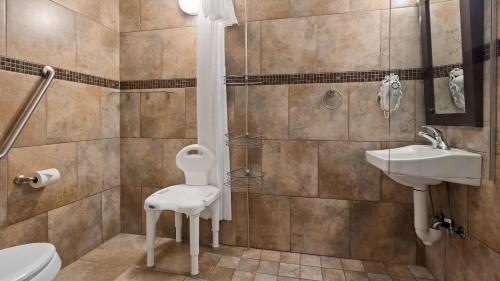 a bathroom with a toilet and a sink at Best Western Plus Kamloops Hotel in Kamloops