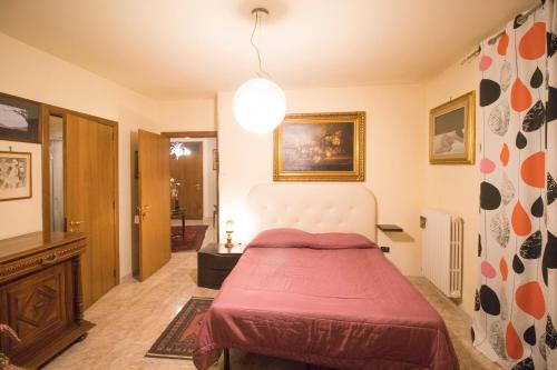 a bedroom with a bed with a red blanket at B&B Luxury in Lecce