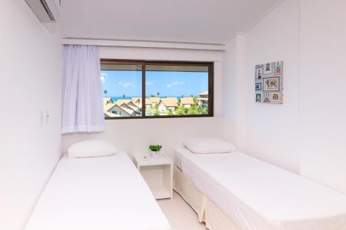 Ένα ή περισσότερα κρεβάτια σε δωμάτιο στο Condomínio Nui Supreme (BY MAI)