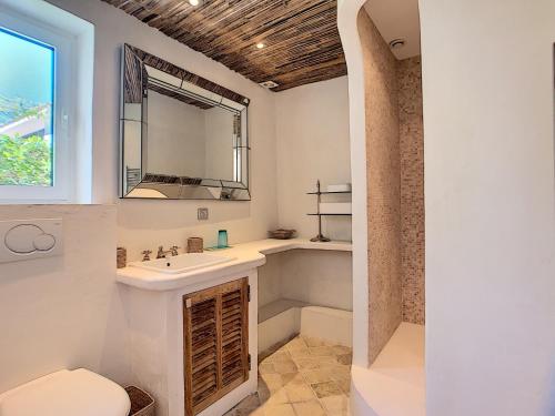 a bathroom with a sink and a mirror at Villa Riviera in Cannes