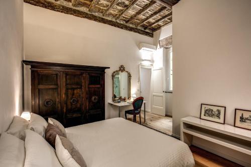 Postel nebo postele na pokoji v ubytování Farnese House in Rome