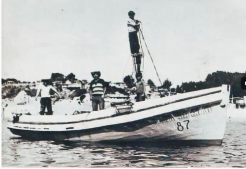 a group of people standing on a boat in the water at Cabañas Mirador de Soledad in El Quisco