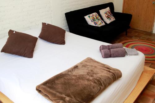 Ένα ή περισσότερα κρεβάτια σε δωμάτιο στο Coyoacan City Lofts