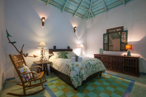 A bed or beds in a room at Casa Abuelita: An exquisite, historic La Paz home