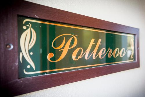 a sign that says pulao on a wall at Potteroo in Rothbury