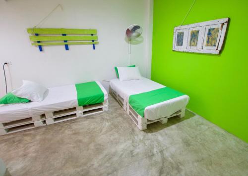 Postel nebo postele na pokoji v ubytování QuillaHost Guesthouse