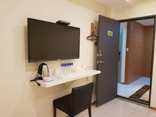 TV a/nebo společenská místnost v ubytování Galaxy Mini Inn