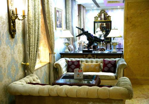 a living room with a couch and a table at Ramada By Wyndham Amritsar in Amritsar