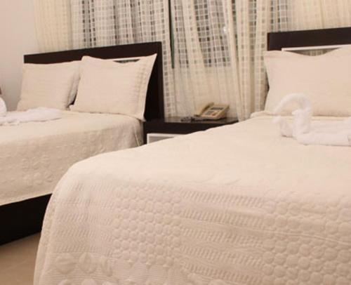 Ένα ή περισσότερα κρεβάτια σε δωμάτιο στο Hostal San Francisco de Asis