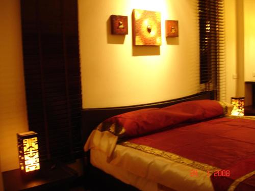 a bedroom with a bed in a room with a window at room 5 pattaya tower in Pattaya Central
