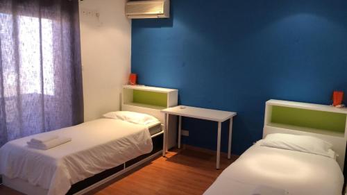 Postel nebo postele na pokoji v ubytování City Living suites TK3 Rm 5