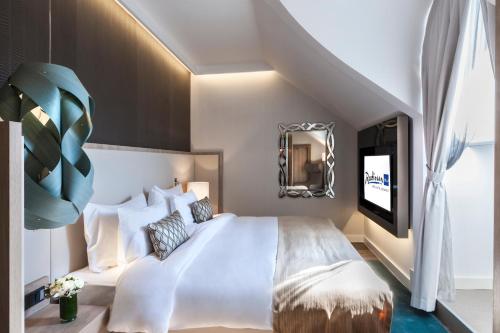 Postel nebo postele na pokoji v ubytování Radisson Blu Béke Hotel, Budapest