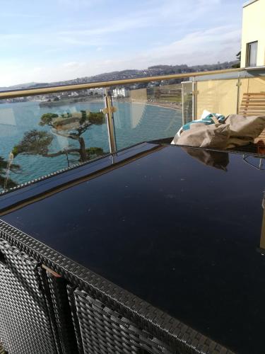 a swimming pool on top of a roof at Panoramic sea views, sleeps 4, Torquay in Torquay