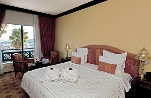 Postel nebo postele na pokoji v ubytování Les Mérinides