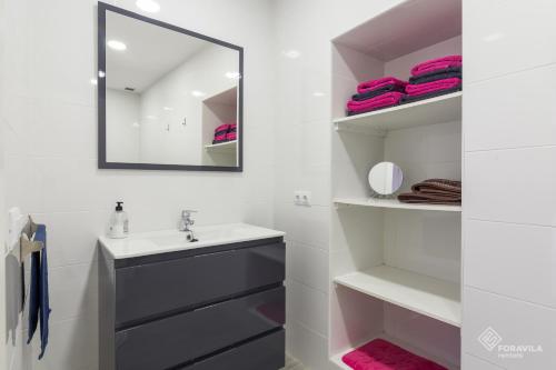a bathroom with a sink and a mirror at S'Estacio in Bunyola