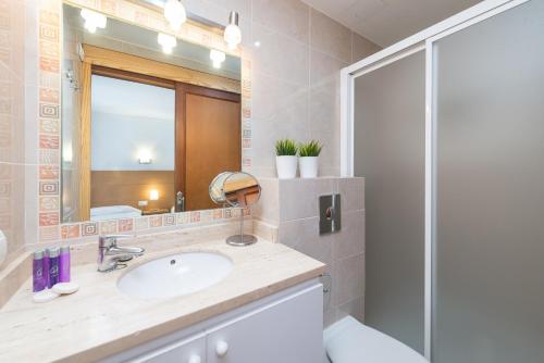a bathroom with a sink and a shower at Sunset Villa Nixe in Alcudia