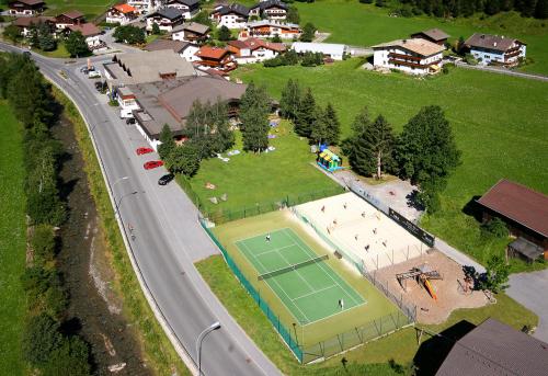 an overhead view of a tennis court and a road at Hotel Lärchenhof in Kaunertal