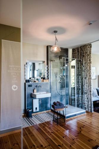 a bathroom with a glass shower and a sink at Sommers "Schöne Aussicht", Adults only in Reichenbach im Vogtland