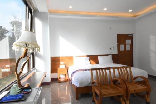 Una cama o camas en una habitación de 巨缿民宿巨象民宿