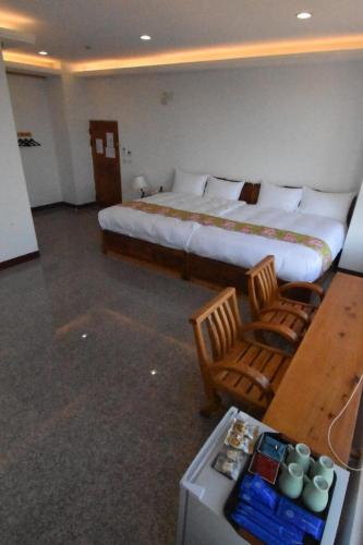 Una cama o camas en una habitación de 巨缿民宿巨象民宿