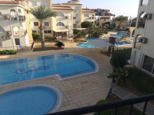 a view of a swimming pool next to some buildings at Boheme B6 Sunrise Beach in Kalecik