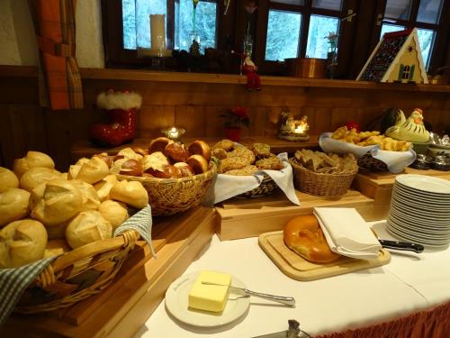 a buffet of bread and pastries on a table at Der Lautenbachhof in Bad Teinach-Zavelstein