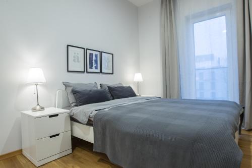 Voodi või voodid majutusasutuse Bright 1BD Apartment in Old Town by Hostlovers toas