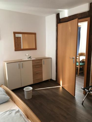 
a room with a bed and a table in it at Hotel Guntia in Günzburg

