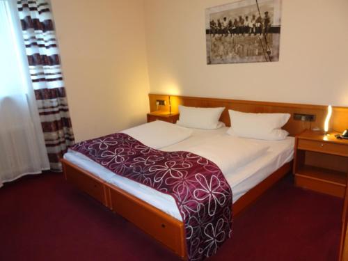 Postel nebo postele na pokoji v ubytování Hotel & Weinstube Restaurant Filling