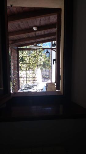 an open door to a patio with a fence at La Bouganville e Il Gelsomino in Pietrasanta