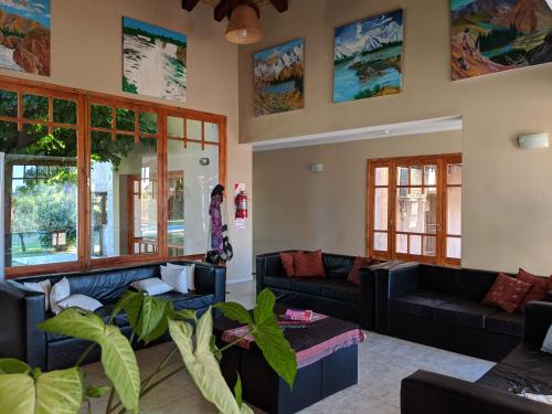 a living room with couches and plants at Posada Cavieres Wine Farm in Maipú