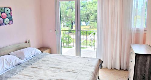 Postel nebo postele na pokoji v ubytování Villa Lily