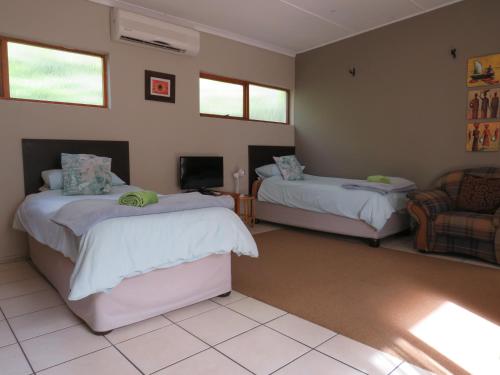 Katil atau katil-katil dalam bilik di Haus Victoria Self Catering Cottages