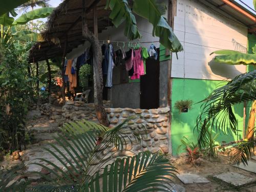 a house with clothes hanging on a clothes line at Freedom home in Ko Chang