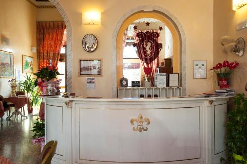 a restaurant with a counter in a room at Albergo Antica Corte Marchesini in Campagna Lupia