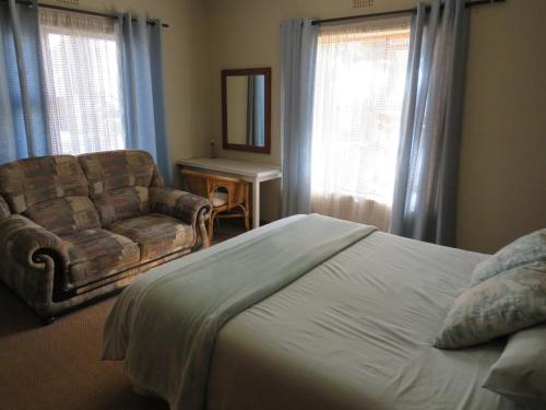 Katil atau katil-katil dalam bilik di Haus Victoria Self Catering Cottages