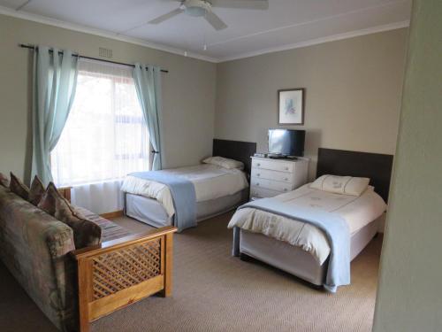 Katil atau katil-katil dalam bilik di Haus Victoria Self Catering Cottages