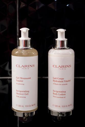 two bottles of cleaning products sitting next to each other at Posada del León de Oro Boutique Hotel in Madrid