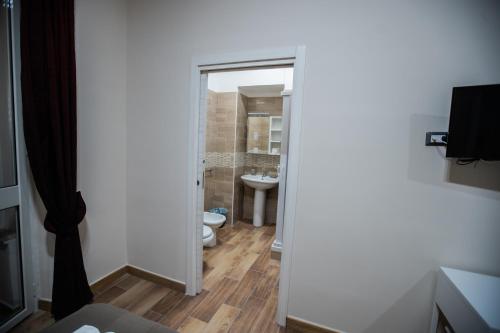a bathroom with a toilet and a sink at Bellorizzonte in Naples