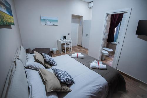 a bedroom with a large bed with pillows on it at Bellorizzonte in Naples