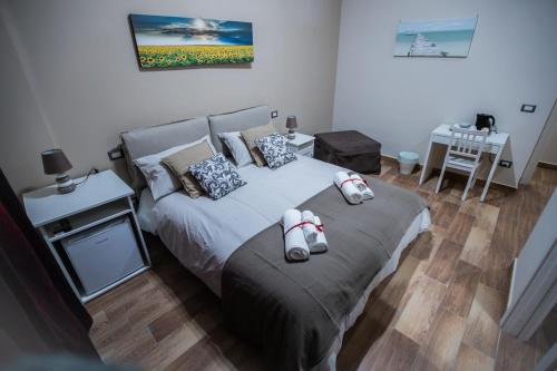 a bedroom with a bed with shoes on it at Bellorizzonte in Naples