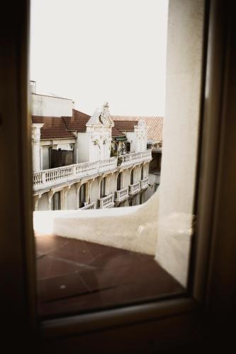 a view from a window of a building at room00 Chueca Hostel in Madrid