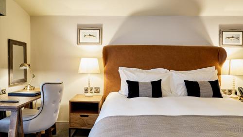 מיטה או מיטות בחדר ב-The Wellington Arms