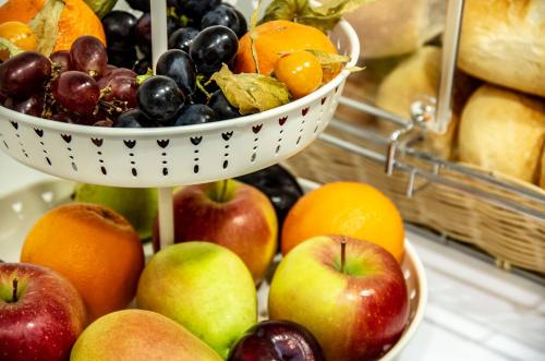 a bunch of fruit in baskets on a table at Ausbildungshotel St. Theresia in Munich