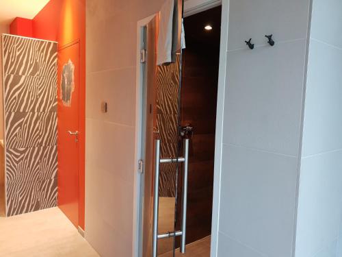 
a door that is open to a bathroom at Zen Your Life in Groot-Bijgaarden
